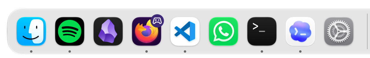 The left end of my Dock, with app icons including Finder, Spotify, Obsidian, Firefox, Visual Studio Code, WhatsApp, and Terminal. Small dots beneath some icons show which apps are running.