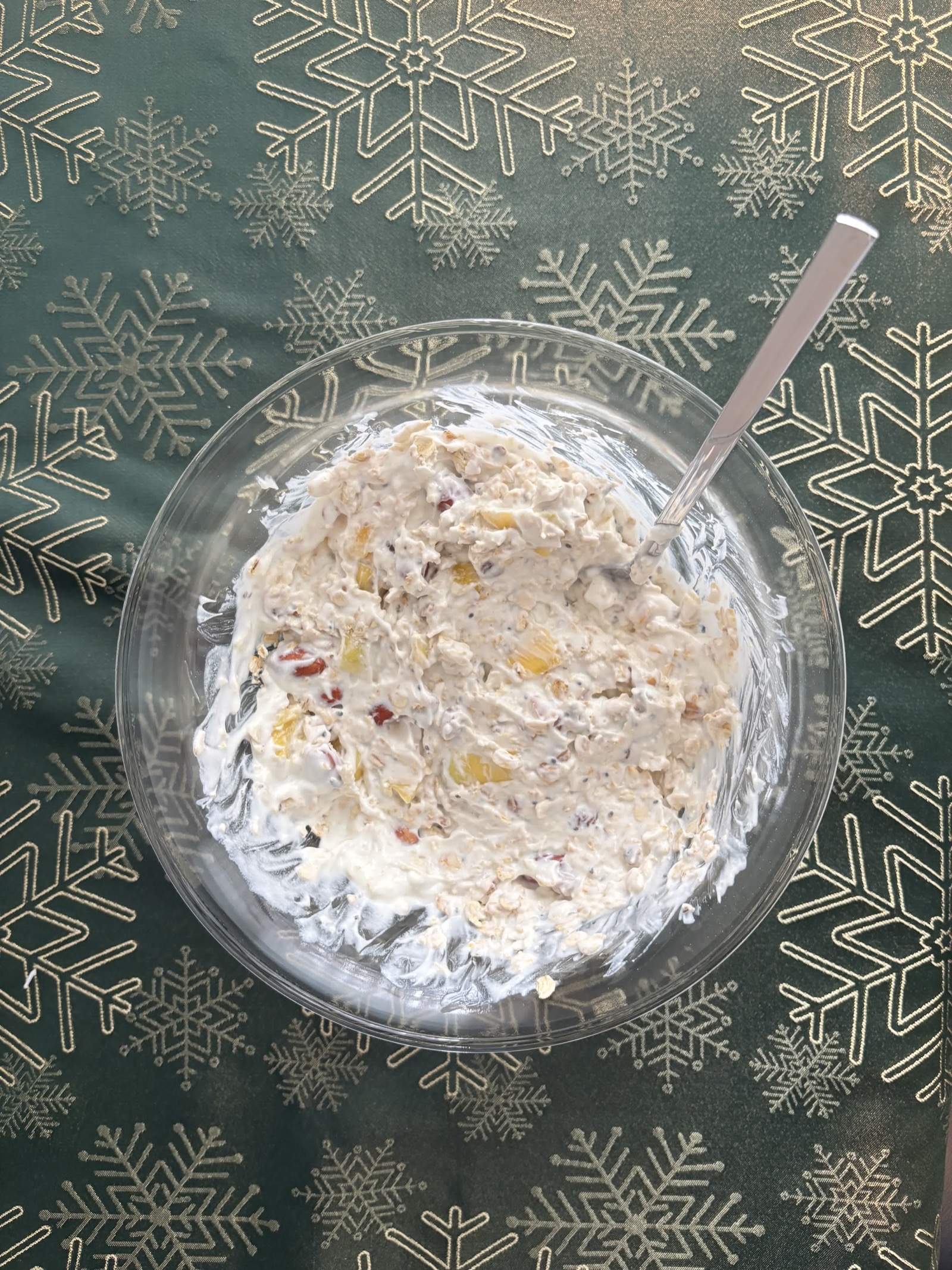 The oat yogurt bowl mixed together with a spoon.